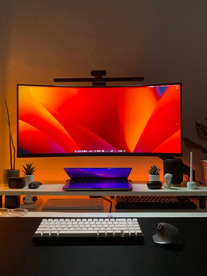 A computer monitor placed on top of a wooden desk