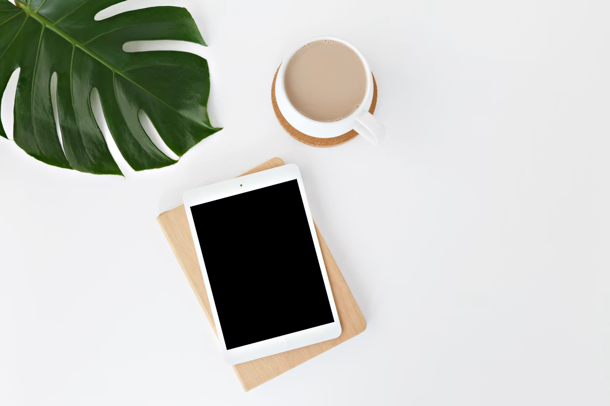 A tablet resting on a bright white surface, ready for a quiet planning session